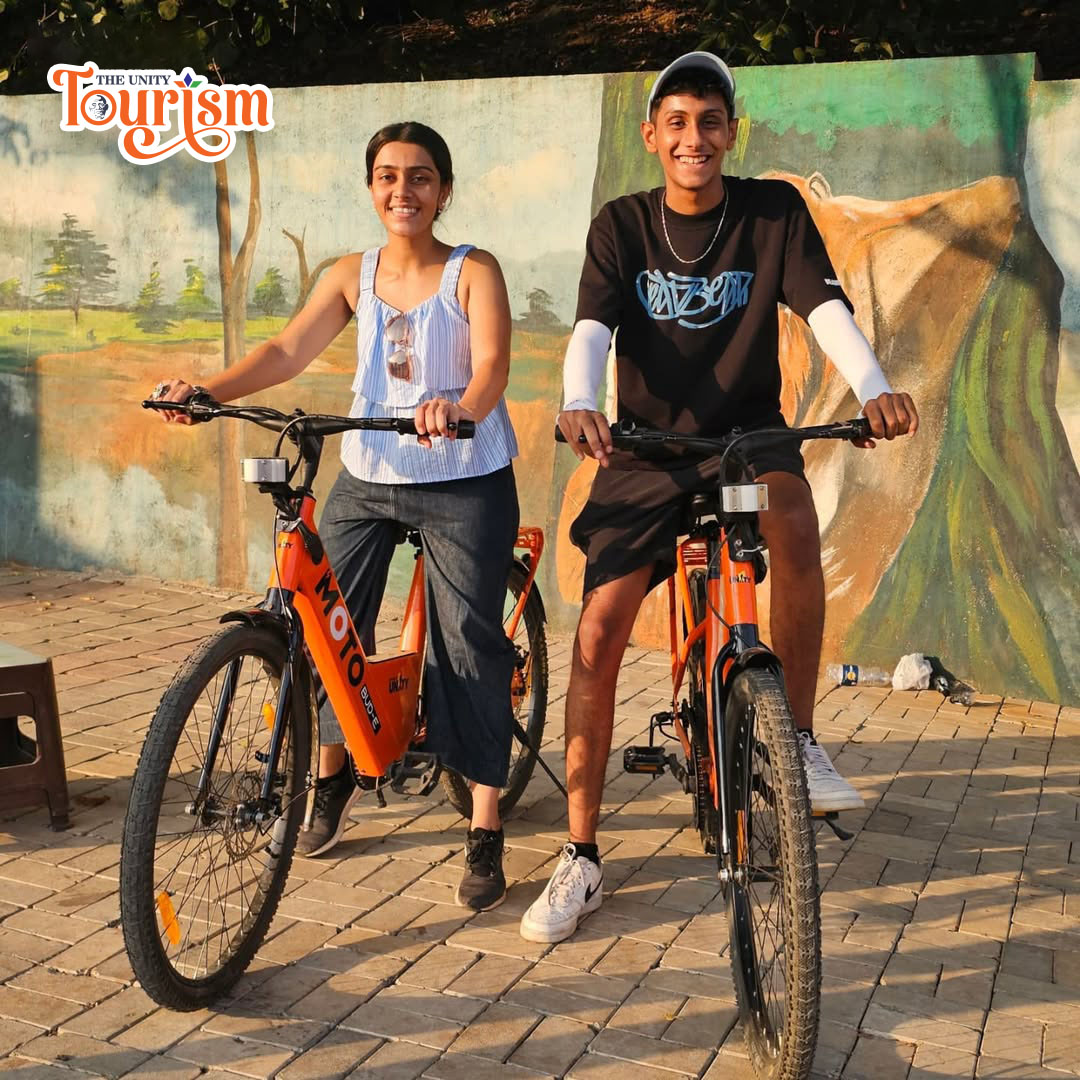 Couple riding bicycles on the dedicated cycling path at Statue of Unity riverfront.